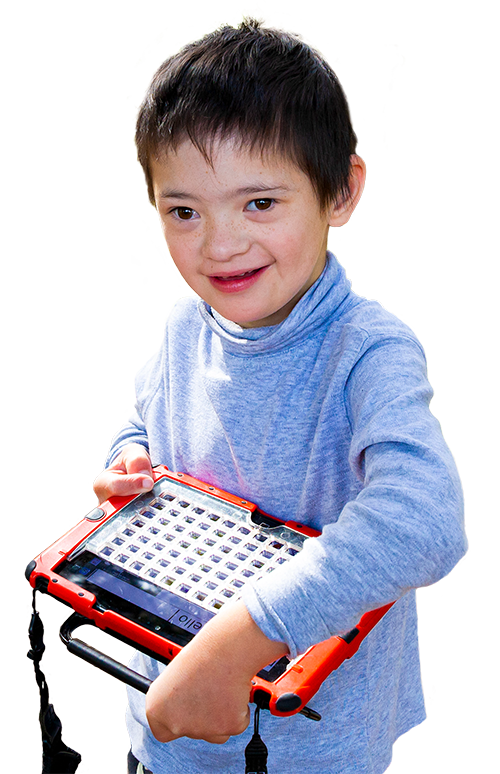 A young boy, Noah, holding a communication device and smiling